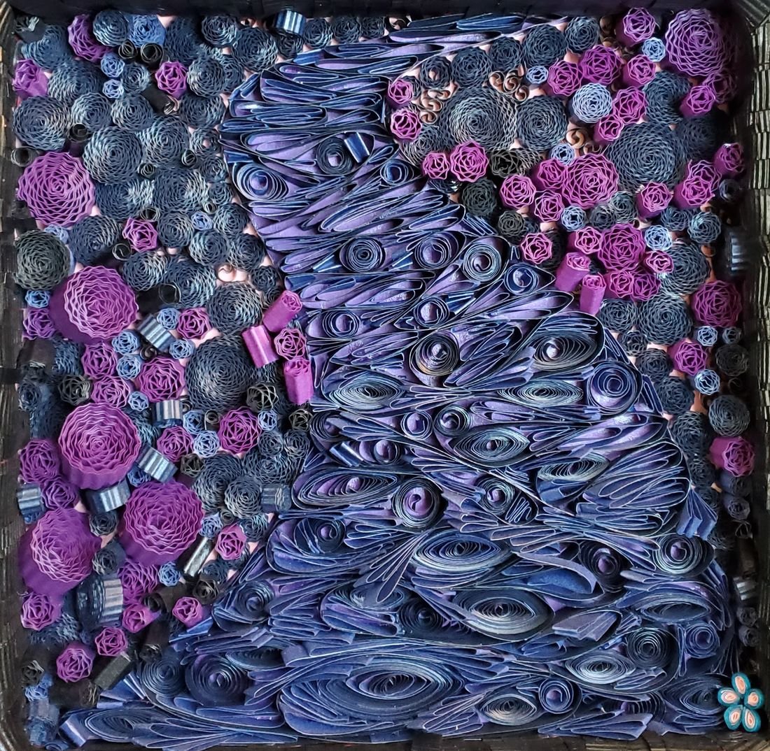 Finding Our Way Through Purple Grief: blue-violet paper strips flowing like water, with magenta quilled flowers along one side