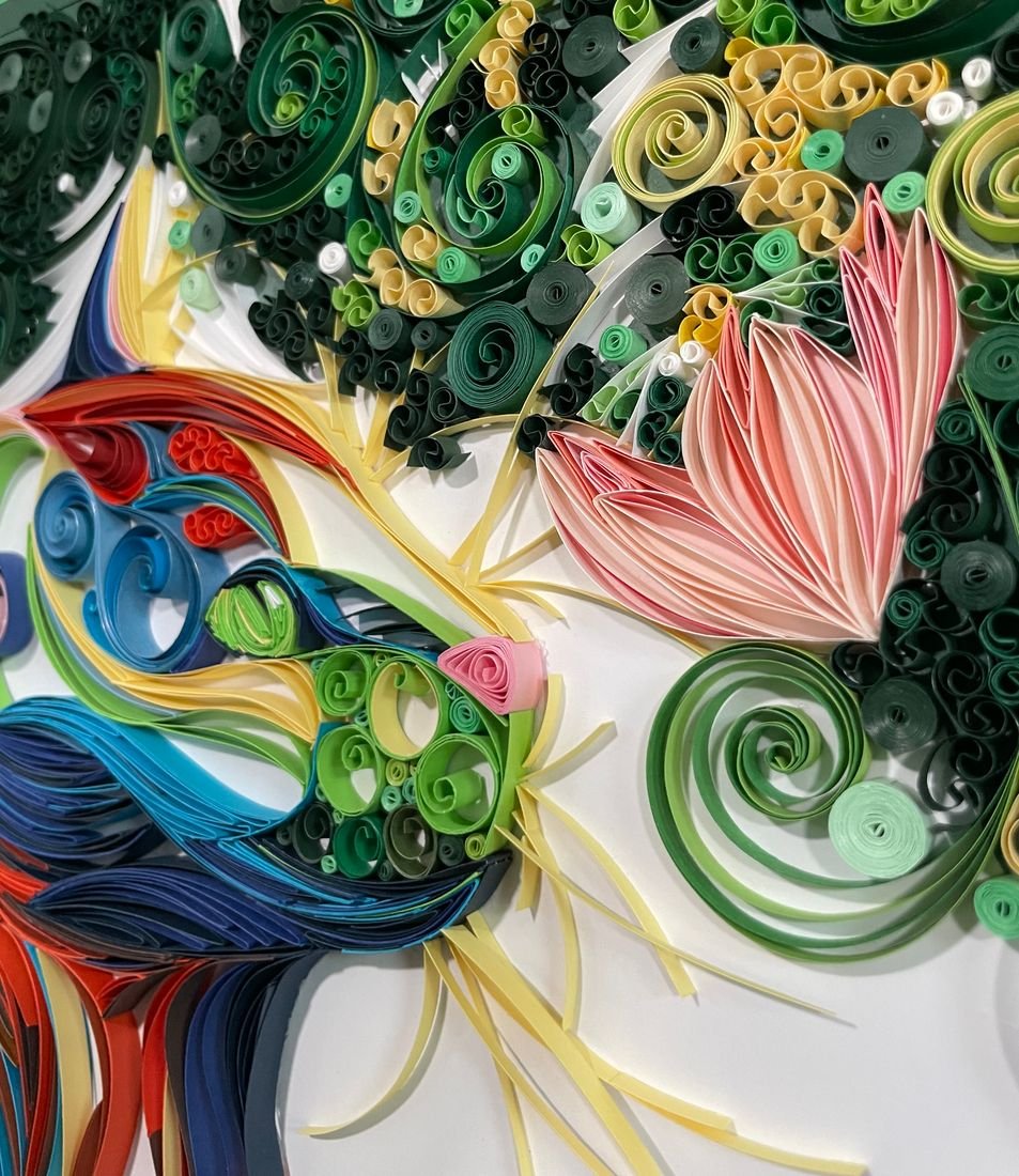 Henry’s Perfect Day: a quilled paper portrait of a cat among green leaves and pink flowers